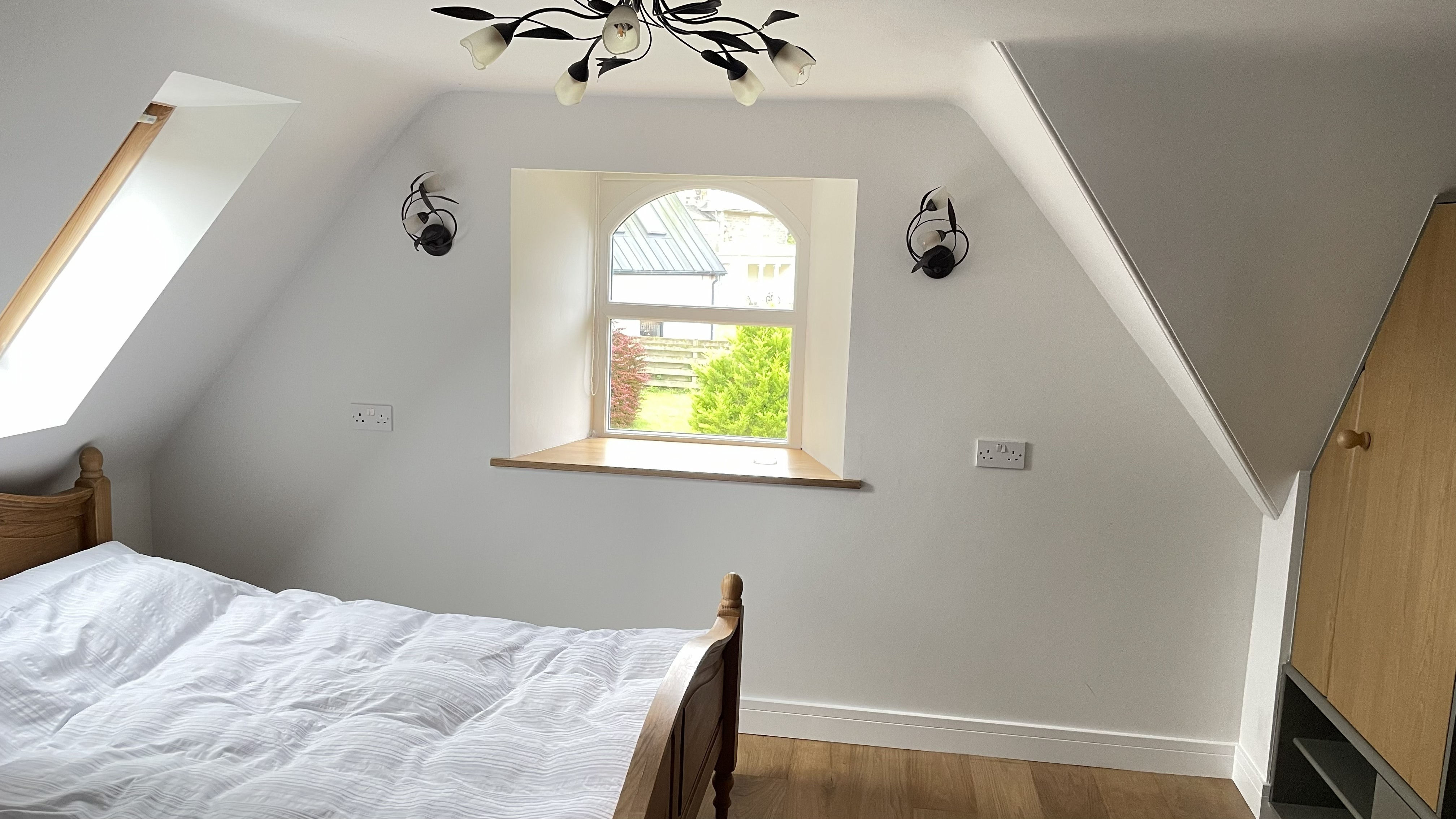 Bedroom with vaulted ceiling